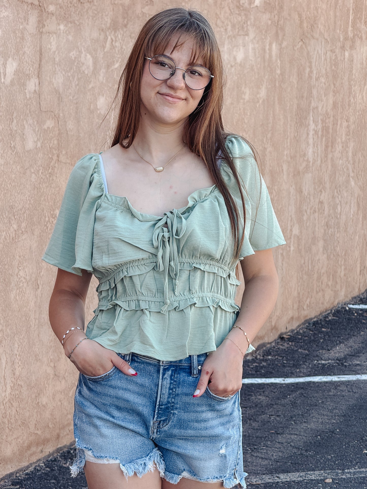 The Sage Blossom Peplum Tie Front Top