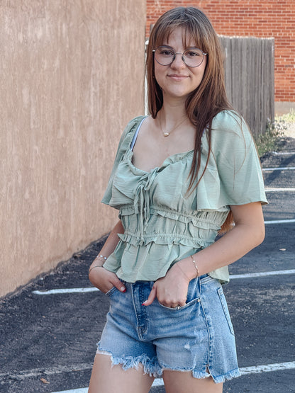 The Sage Blossom Peplum Tie Front Top
